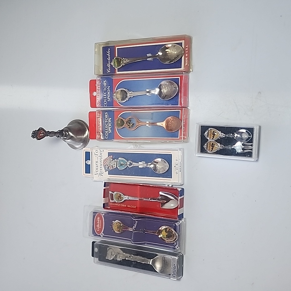 Set of 8 Collectible Souvenir Spoons and 1 Skunk Train Bell Japan.